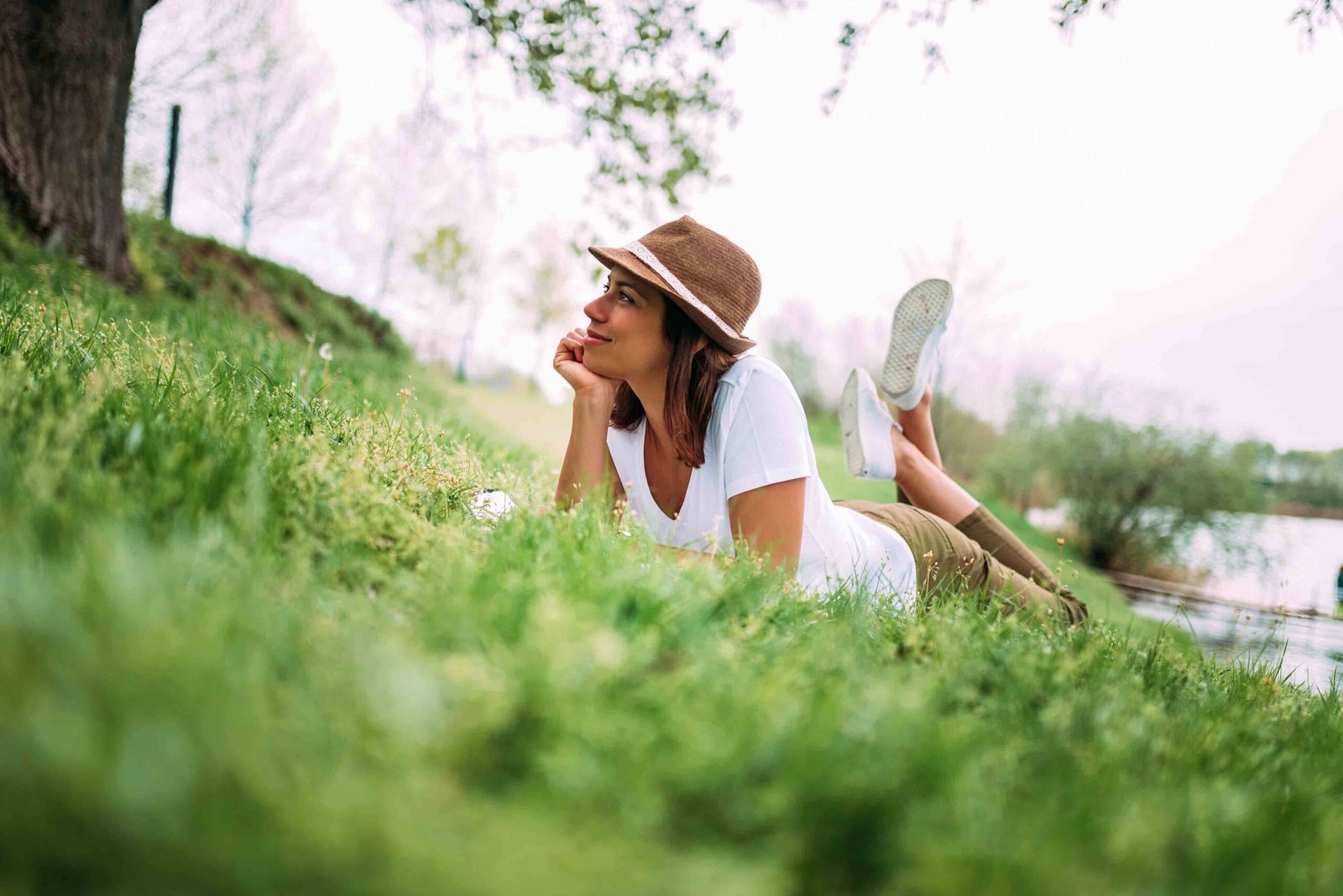 beautiful-girl-green-grass-laying-enjoying-beautiful-day